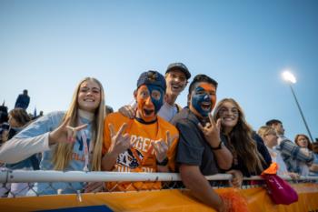 students cheering at a football game
